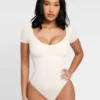 Body gainant femme avec maintien poitrine et contrôle du ventre